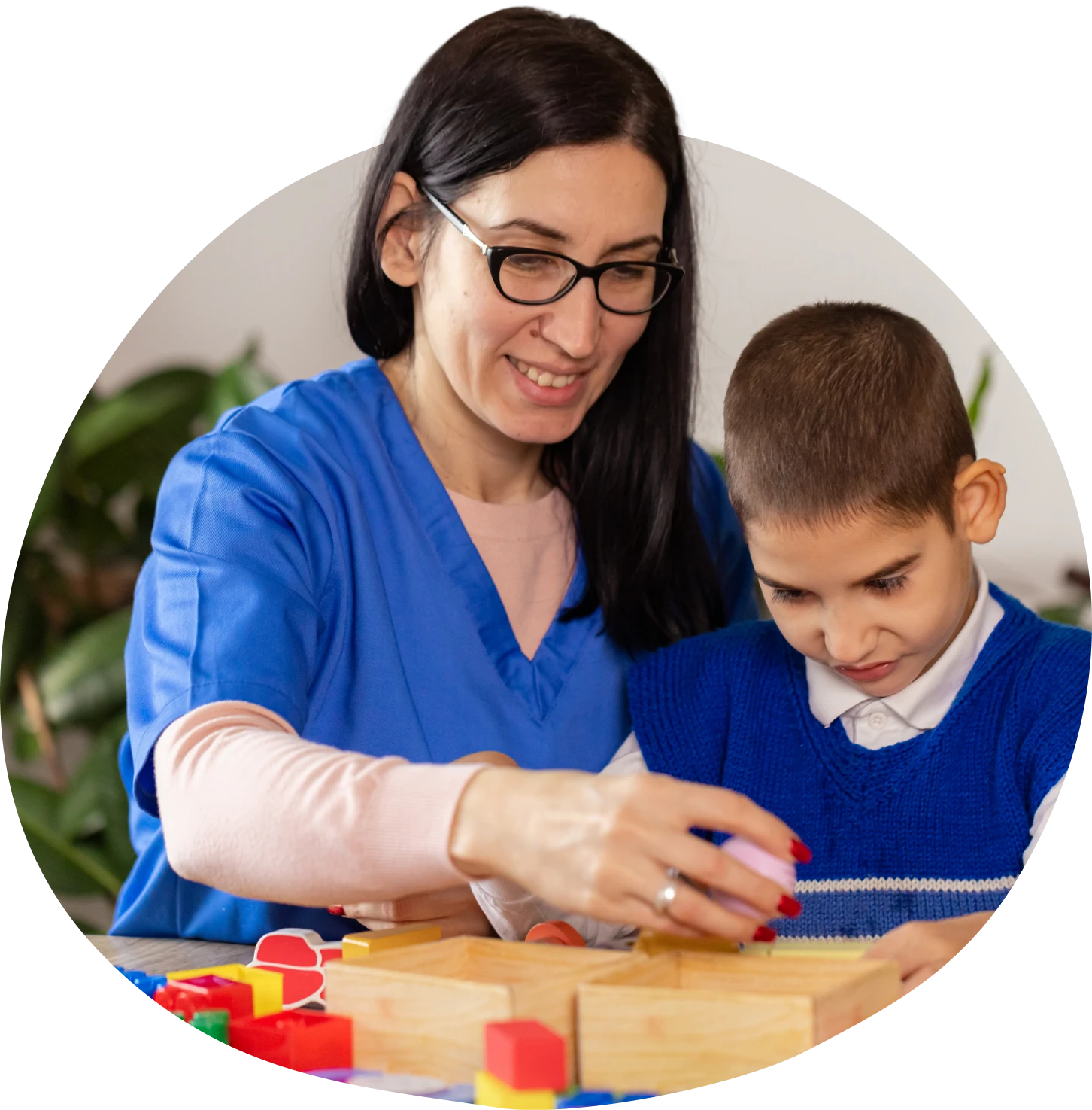 Educator and student playing together